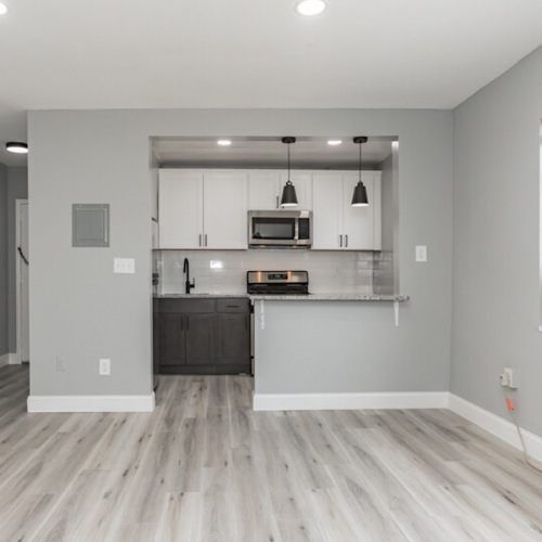 Living Spaces Suited For You spacious room that connects to the kitchen
