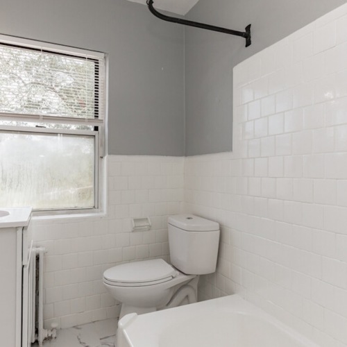 Modern Bathroom Area bathroom with a large mirror and ample lighting