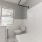 bathroom with a large mirror and ample lighting