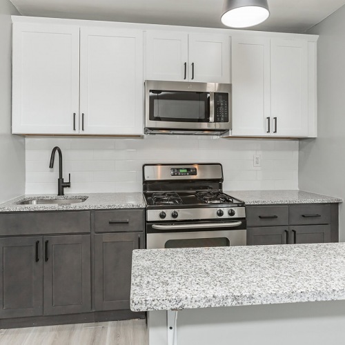Spacious Kitchens with Thoughtful Details kitchen with white cabinets and stainless steel appliances
